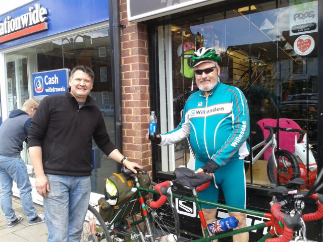 Passerby nabs a crafty selfie with a green manaquin